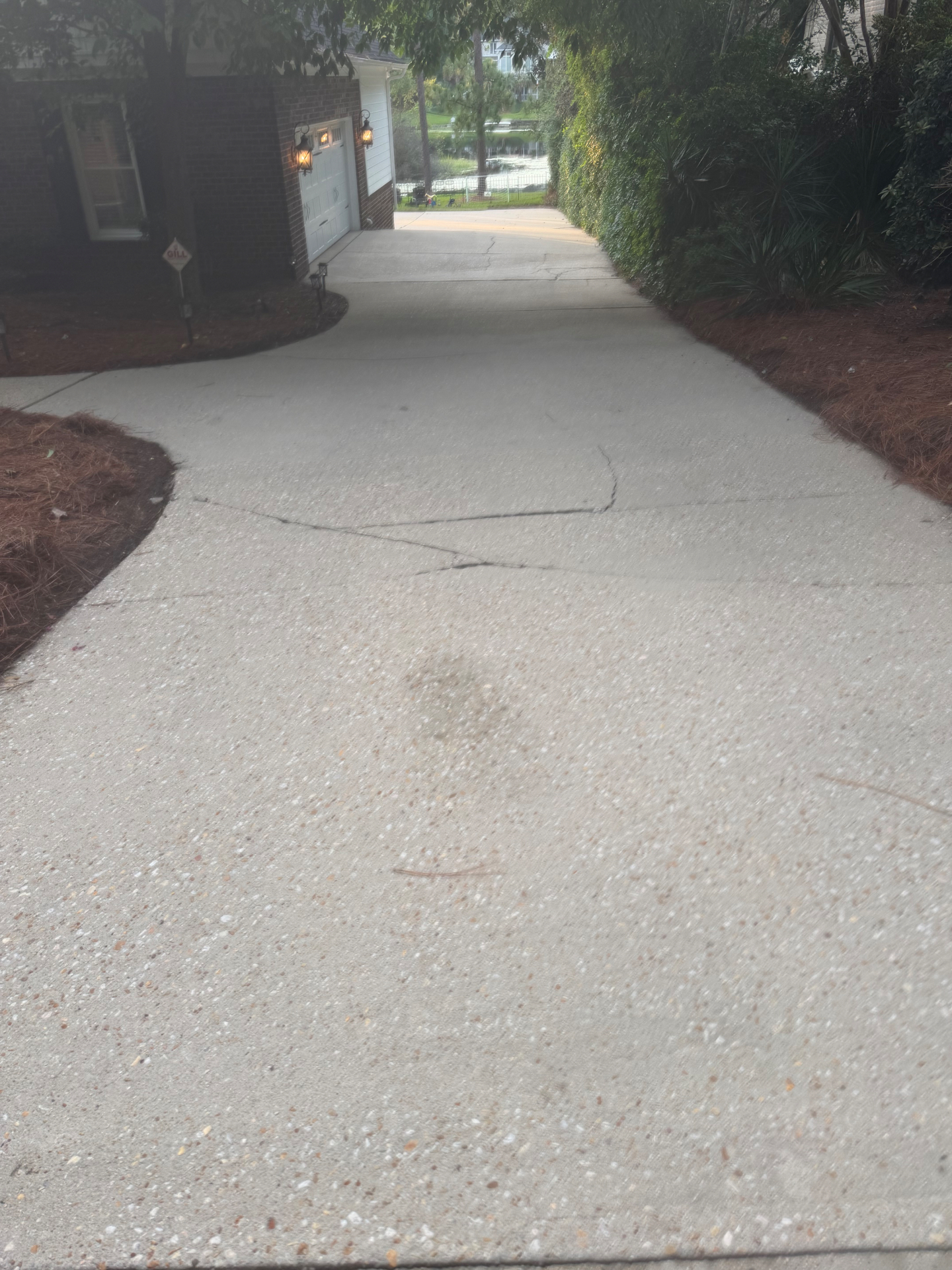 The same driveway after pressure washing, with dirt and grime removed for a cleaner appearance